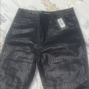 Snake skin coated denim jeans